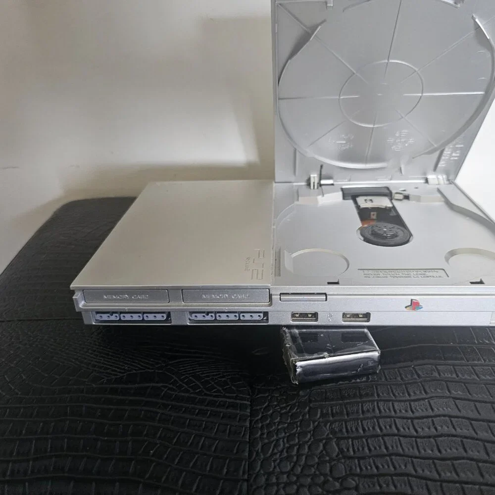 Playsation 2 (PS2 Fat) with controllers and games and PS2 Slim